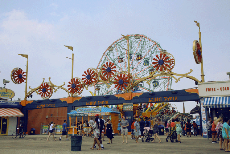 Luna park with people walking in Coney Island
