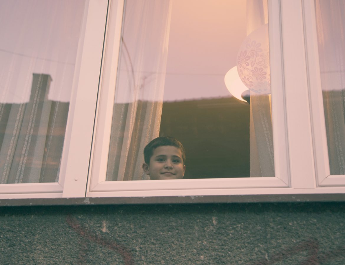 Protest kid behind window