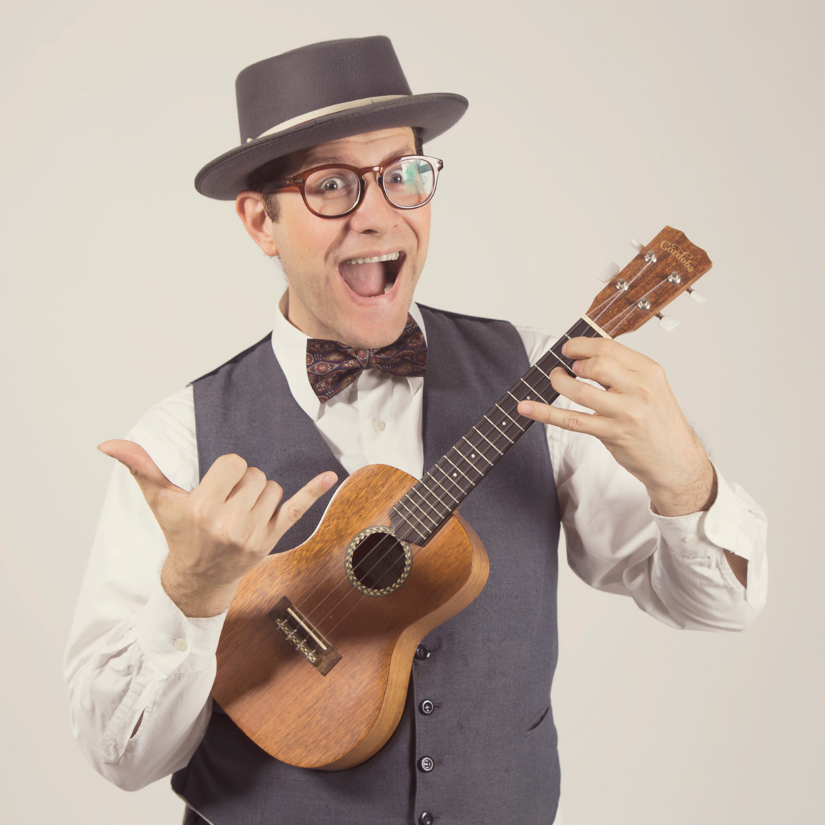 Guy holding ukulele instrument