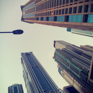 View from below toward skyscrapers and sky in Dubai