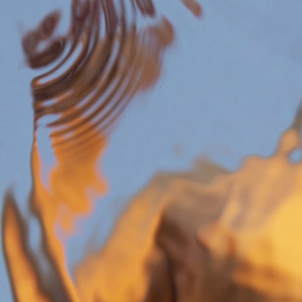 abstract female figure distorted by water ripples - detail