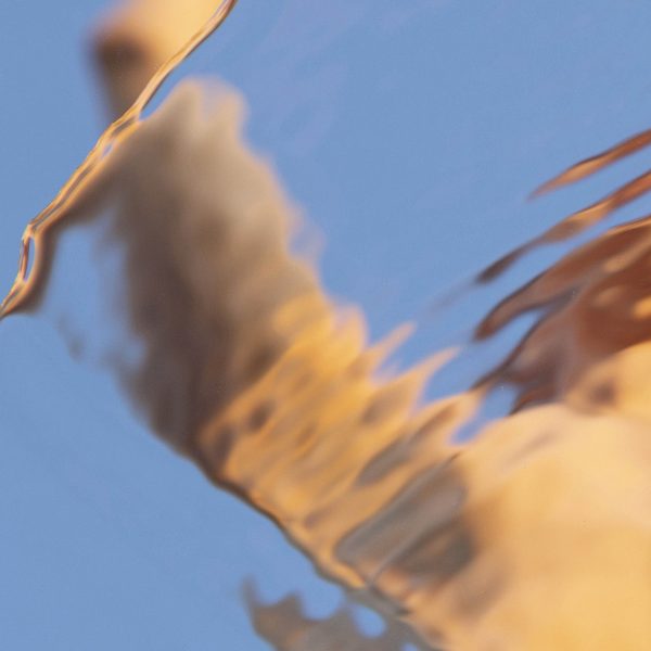 abstract female figure distorted by water ripples - detail