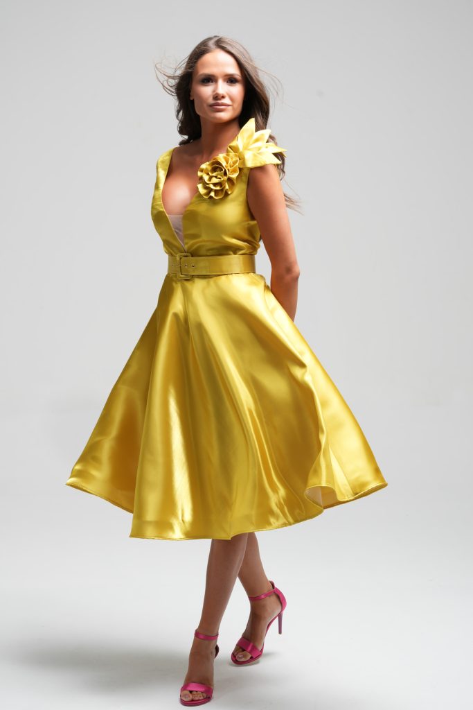 Fashion model posing in yellow dress